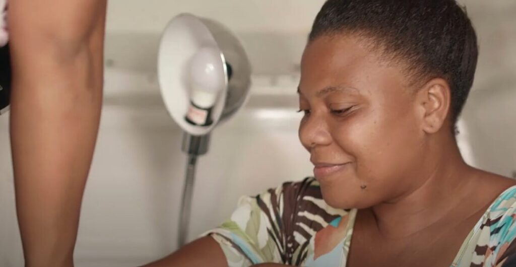 A woman is having her blood pressure measured at a Profamilia Mobile Unit.