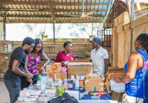 Five people putting together aid boxes.