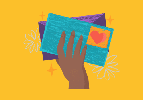 Hand holding envelopes with a heart stamp.