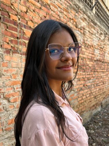 Valeria Vargas, 18, smiles outdoors in Caracas, Venezuela.